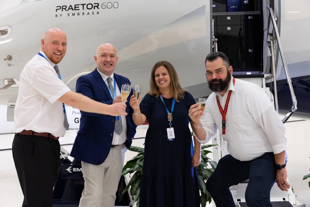 AIR CHARTER SCOTLAND'S CONTINUING AIRWORTHINESS MANAGER, RICHARD ROONEY; AIR CHARTER SCOTLAND'S COO DEREK THOMSON; EMBRAER CUSTOMER ACCOUNT MANAGER, JENNY MANNING AND EMBRAER DELIVERY SPECIALIST, JEREMIAH ORR WITH THE NEW PRAETOR 600 AT EMBRAER AIRCRAFT -  MELBOURNE, FL AHEAD OF FERRY FLIGHT TO THE UK.